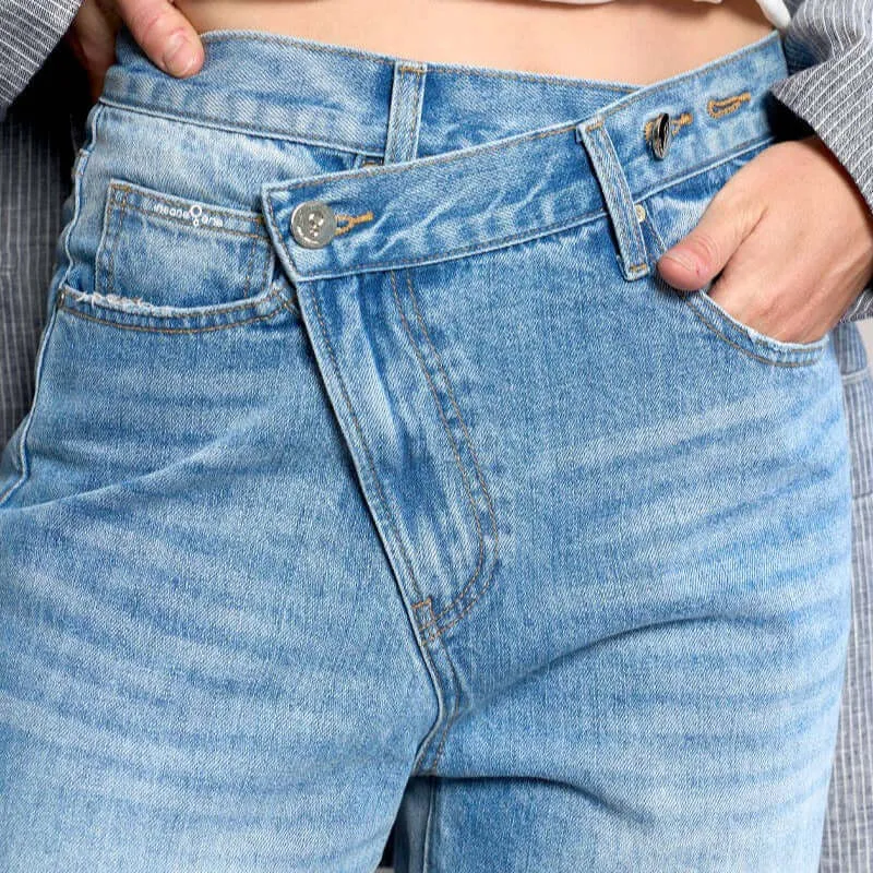 High Rise Ripped Raw Hem Crossover Jeans